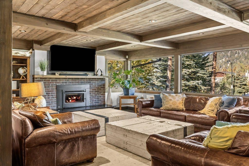 115 Spray Avenue, Banff, AB - Indoor Photo Showing Living Room With Fireplace
