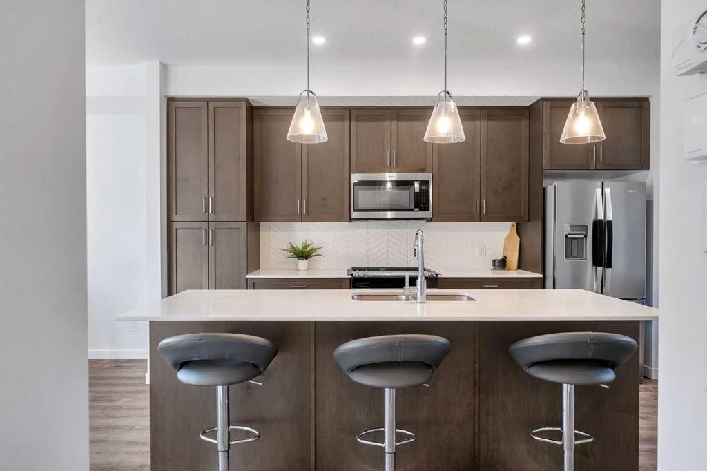 72 Creekside Boulevard Sw, Calgary, AB - Indoor Photo Showing Kitchen With Double Sink With Upgraded Kitchen