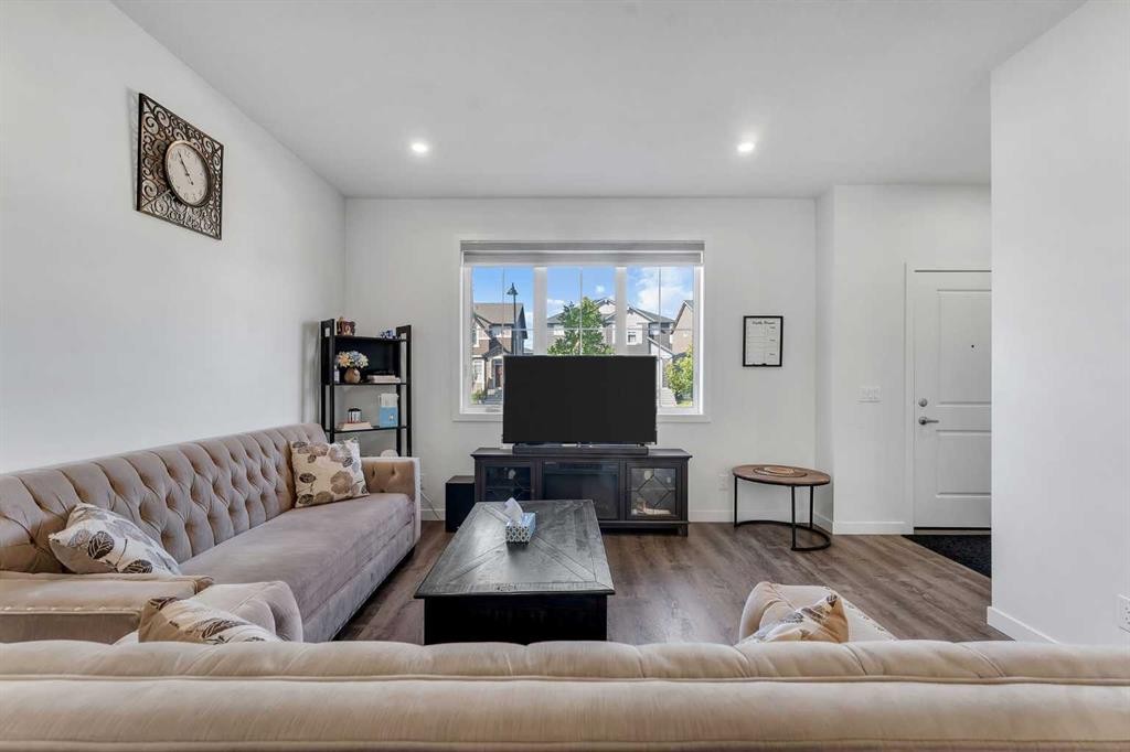 72 Creekside Boulevard Sw, Calgary, AB - Indoor Photo Showing Living Room