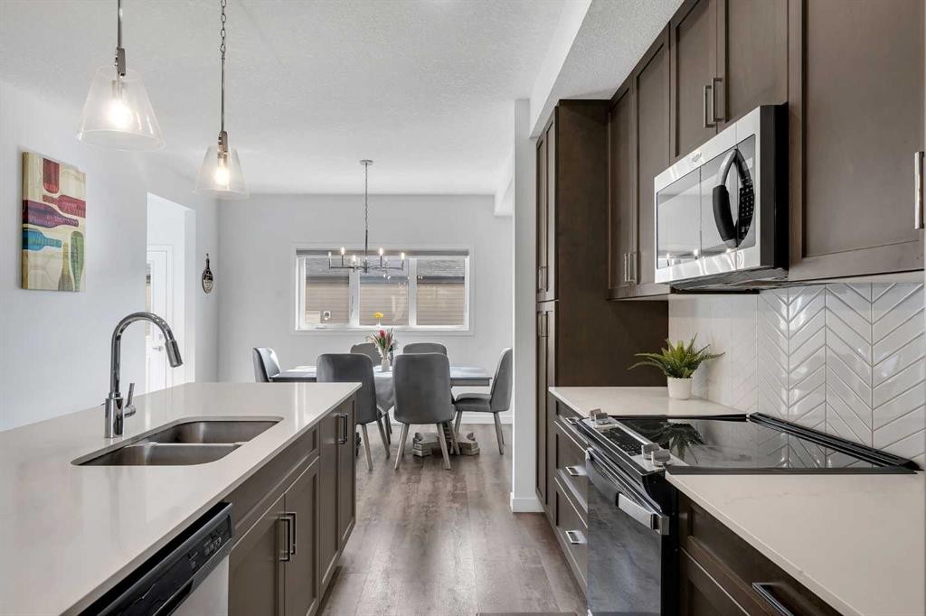 72 Creekside Boulevard Sw, Calgary, AB - Indoor Photo Showing Kitchen With Double Sink With Upgraded Kitchen