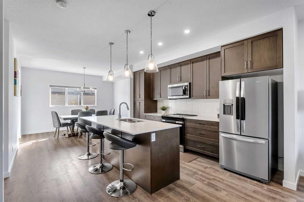 72 Creekside Boulevard Sw, Calgary, AB - Indoor Photo Showing Kitchen With Upgraded Kitchen