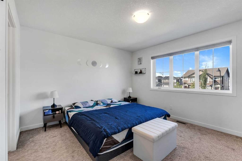 72 Creekside Boulevard Sw, Calgary, AB - Indoor Photo Showing Bedroom