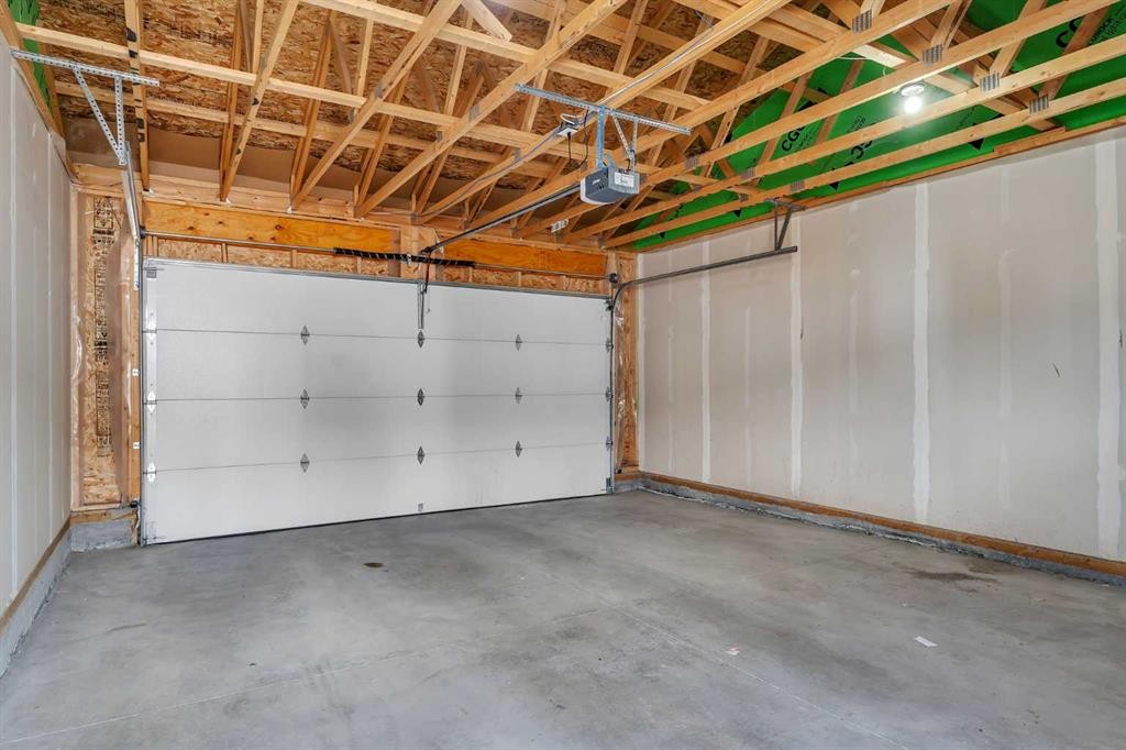 72 Creekside Boulevard Sw, Calgary, AB - Indoor Photo Showing Garage