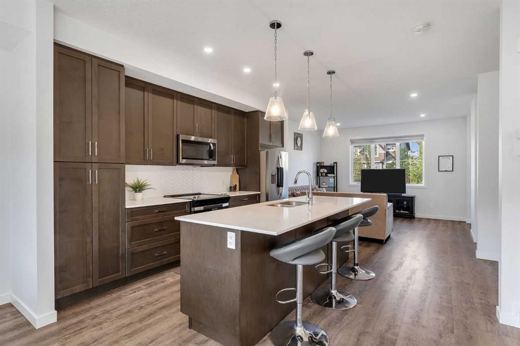 72 Creekside Boulevard Sw, Calgary, AB - Indoor Photo Showing Kitchen With Upgraded Kitchen