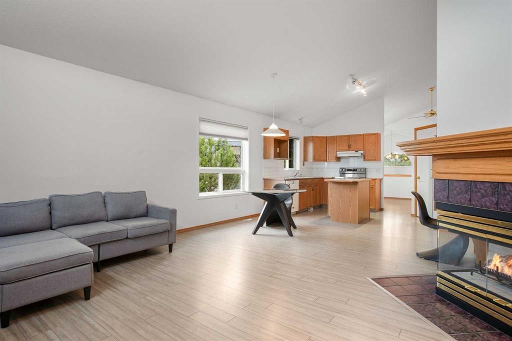 70 Anaheim Green Ne, Calgary, AB - Indoor Photo Showing Living Room With Fireplace