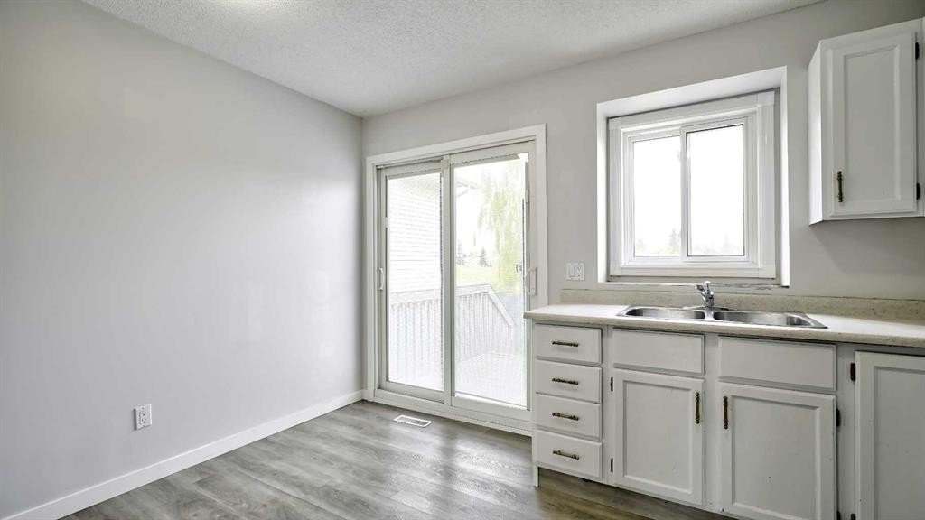 124 Riverbrook Way Se, Calgary, AB - Indoor Photo Showing Kitchen With Double Sink