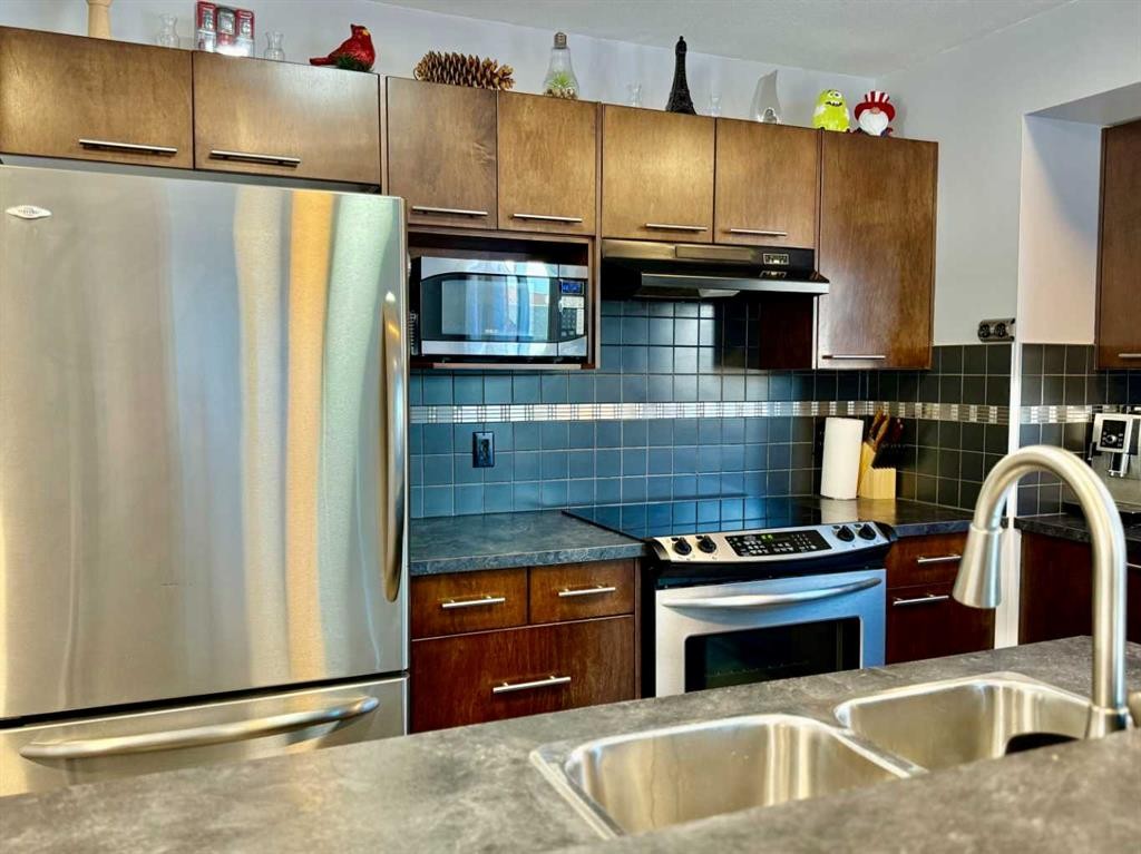 43 Bridlecrest Road Sw, Calgary, AB - Indoor Photo Showing Kitchen With Stainless Steel Kitchen With Double Sink