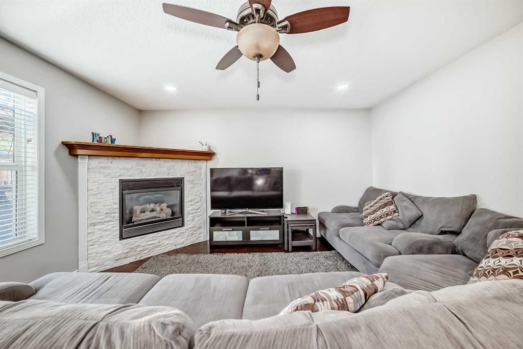 574 Chaparral Drive Se, Calgary, AB - Indoor Photo Showing Living Room With Fireplace