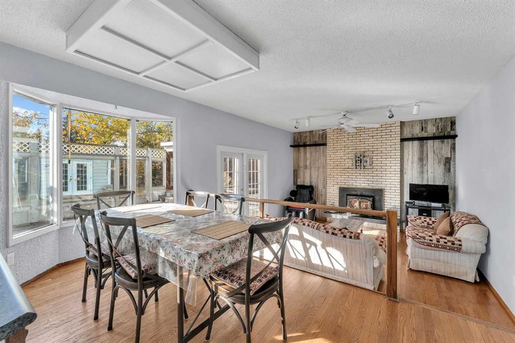 233081 Glenmore View Road, Rural Rocky View County, AB - Indoor Photo Showing Dining Room With Fireplace