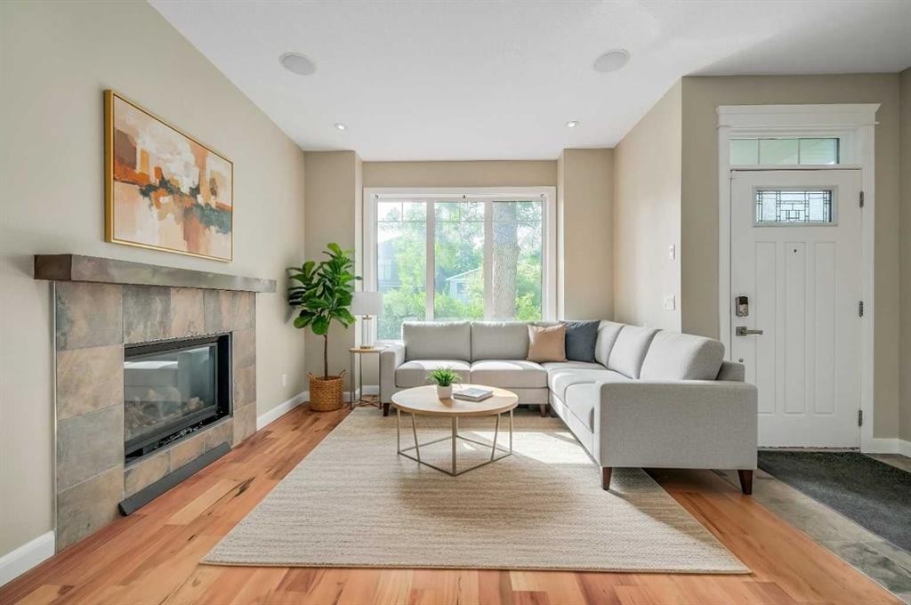 7418 36 Avenue Nw, Calgary, AB - Indoor Photo Showing Living Room With Fireplace