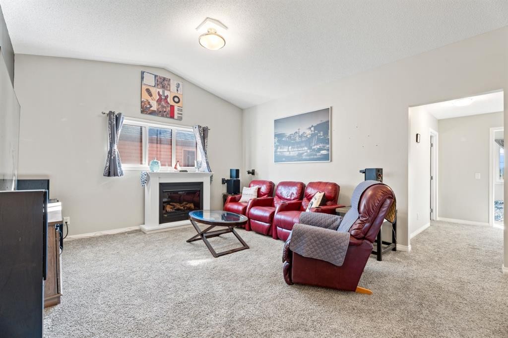 178 Buckskin Way, Cochrane, AB - Indoor Photo Showing Living Room With Fireplace