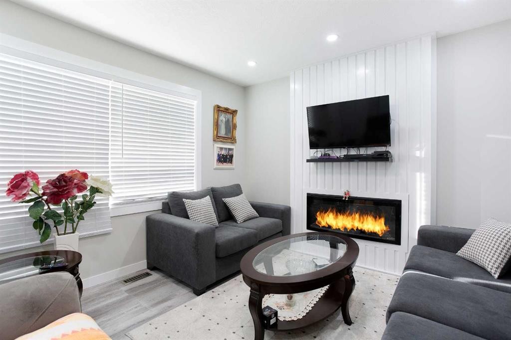119 Maranda Close Ne, Calgary, AB - Indoor Photo Showing Living Room With Fireplace