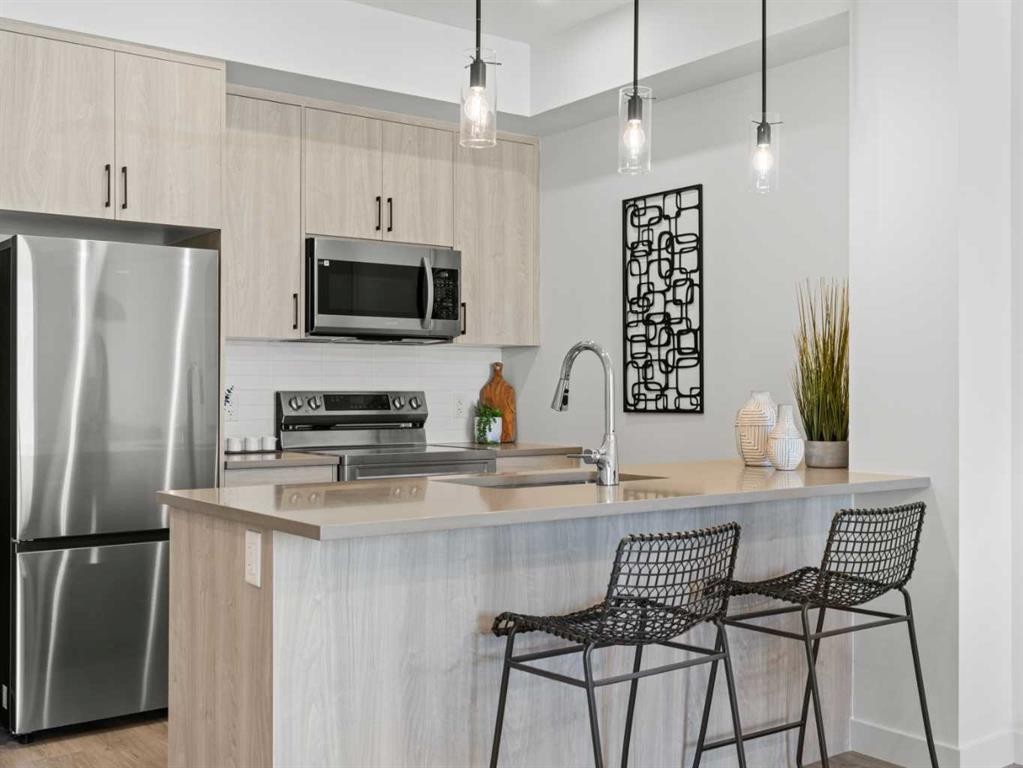 A109-2026 81 Street Sw, Calgary, AB - Indoor Photo Showing Kitchen With Upgraded Kitchen