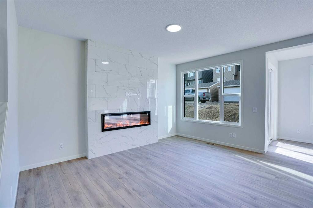 312 Edith Place Nw, Calgary, AB - Indoor Photo Showing Living Room With Fireplace