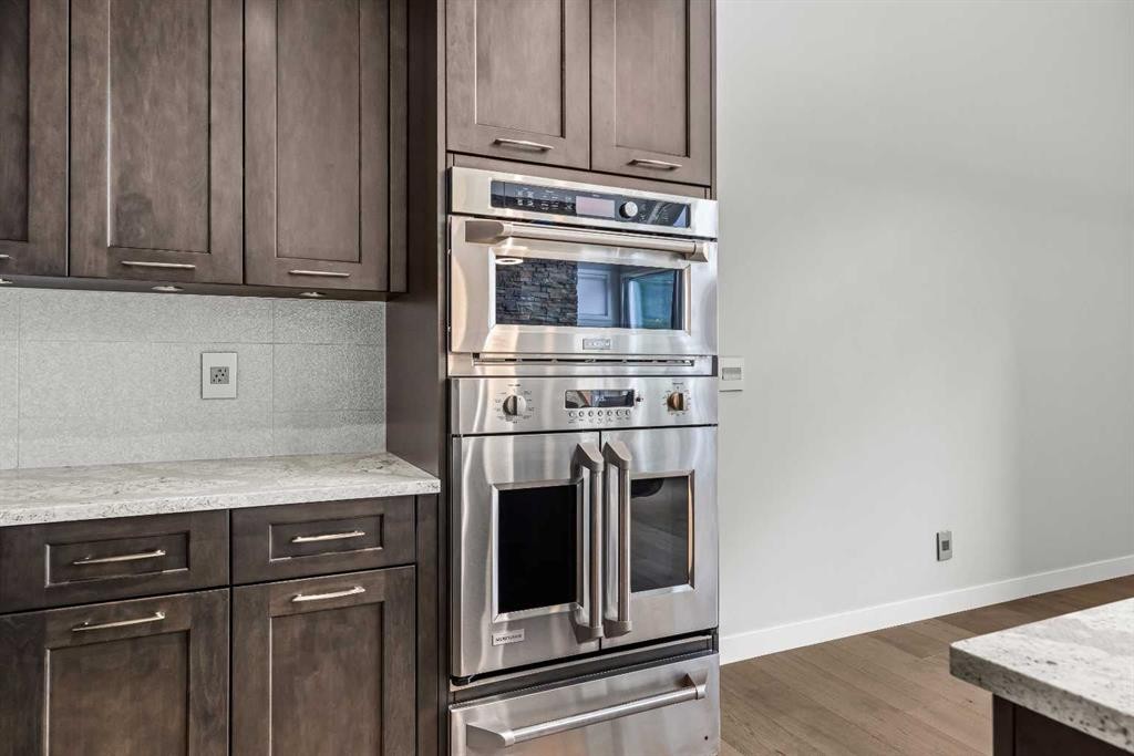 204-105 Stewart Creek Rise Sw, Canmore, AB - Indoor Photo Showing Kitchen