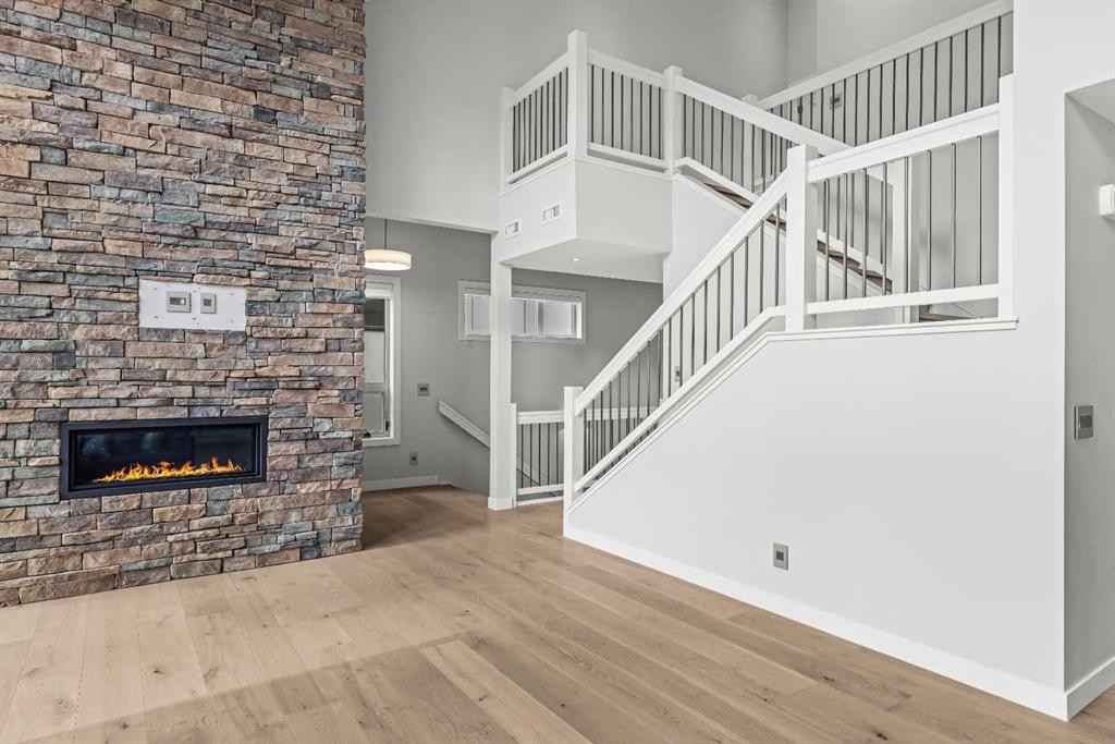 204-105 Stewart Creek Rise Sw, Canmore, AB - Indoor With Fireplace