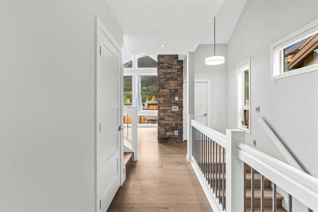 204-105 Stewart Creek Rise Sw, Canmore, AB - Indoor Photo Showing Other Room