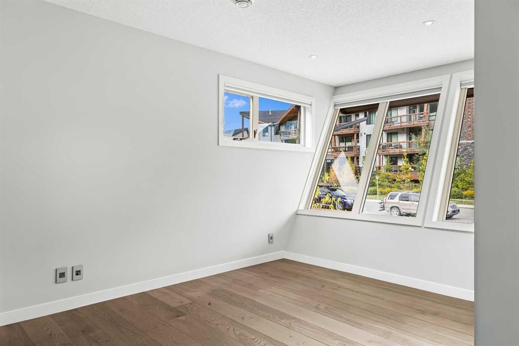 204-105 Stewart Creek Rise Sw, Canmore, AB - Indoor Photo Showing Other Room