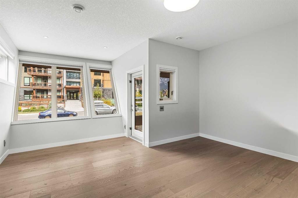 204-105 Stewart Creek Rise Sw, Canmore, AB - Indoor Photo Showing Other Room