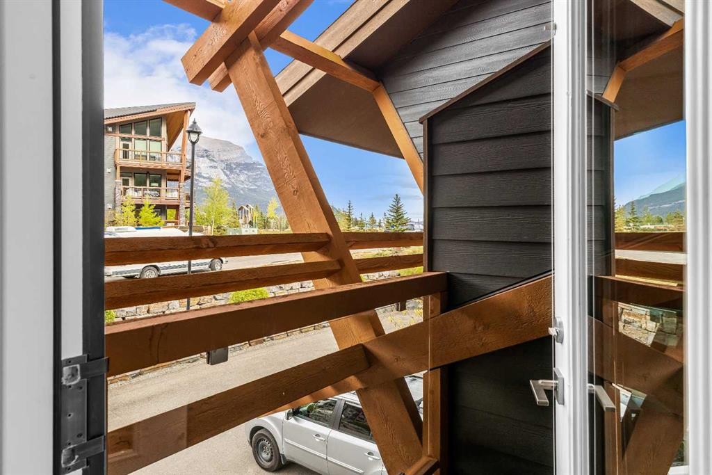204-105 Stewart Creek Rise Sw, Canmore, AB - Outdoor With Balcony With Exterior