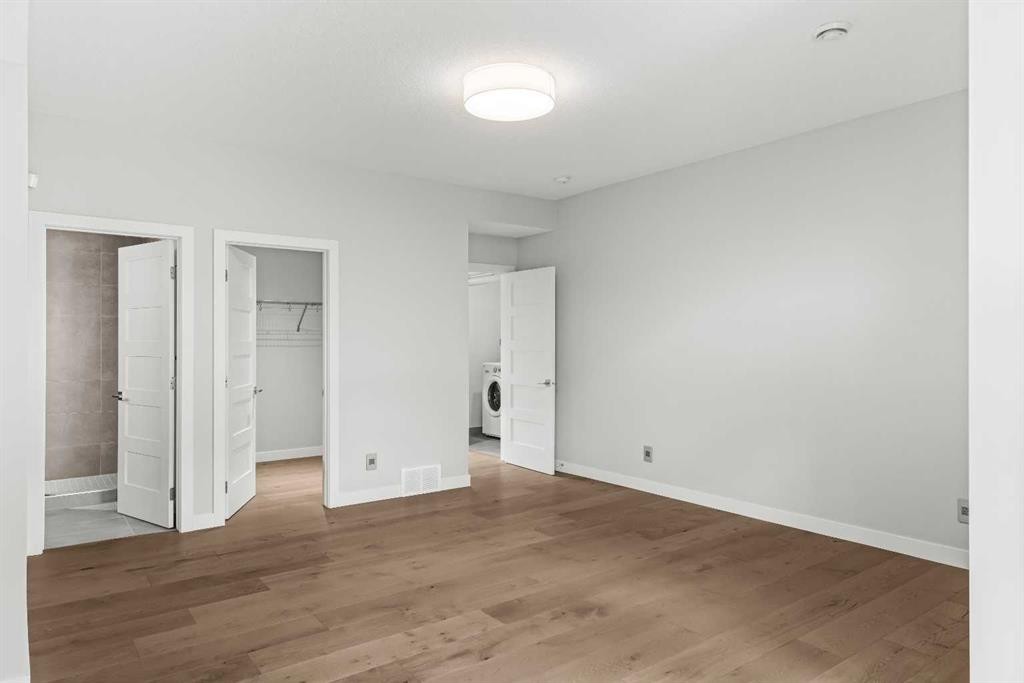 204-105 Stewart Creek Rise Sw, Canmore, AB - Indoor Photo Showing Other Room