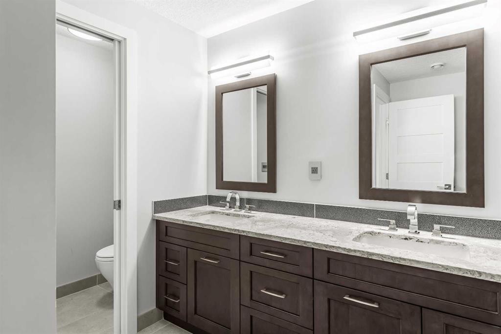 204-105 Stewart Creek Rise Sw, Canmore, AB - Indoor Photo Showing Bathroom