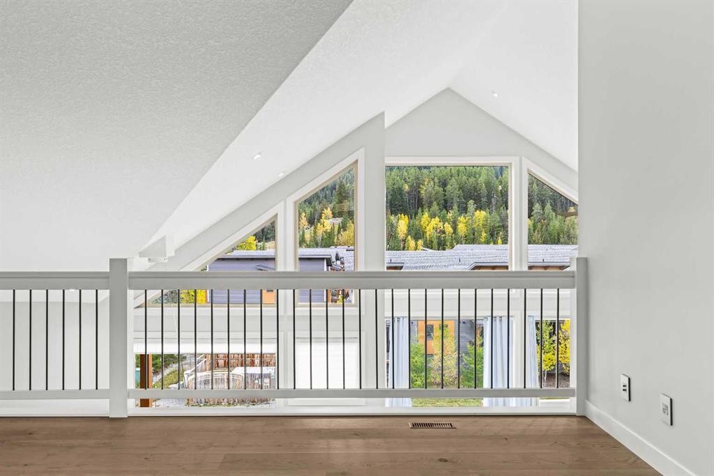 204-105 Stewart Creek Rise Sw, Canmore, AB - Indoor Photo Showing Other Room