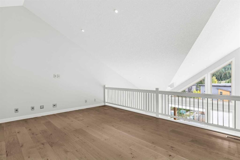 204-105 Stewart Creek Rise Sw, Canmore, AB - Indoor Photo Showing Other Room