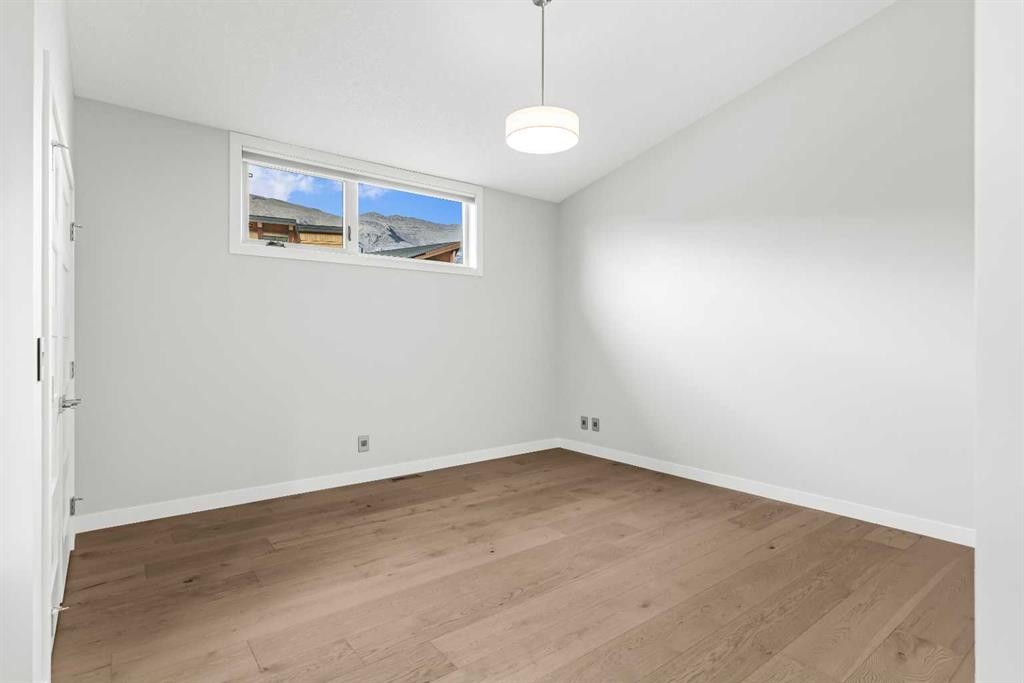 204-105 Stewart Creek Rise Sw, Canmore, AB - Indoor Photo Showing Other Room