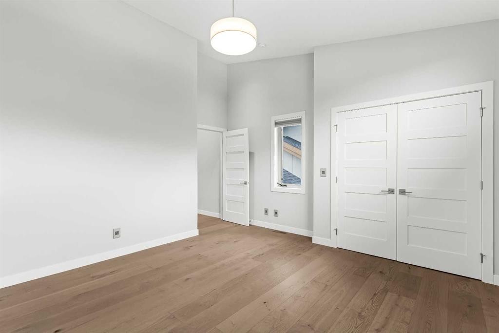 204-105 Stewart Creek Rise Sw, Canmore, AB - Indoor Photo Showing Other Room