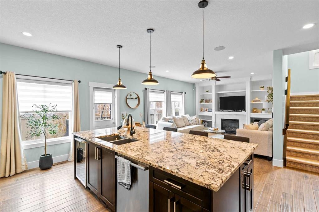 148 Baysprings Court Sw, Airdrie, AB - Indoor Photo Showing Kitchen With Double Sink With Upgraded Kitchen