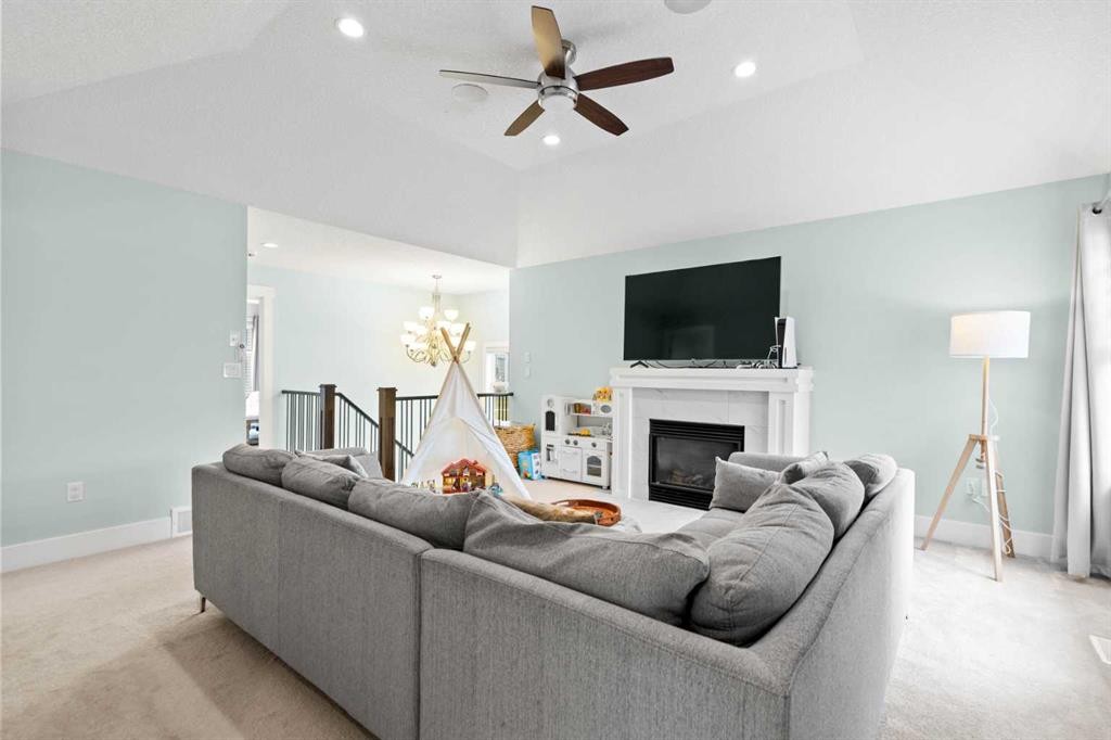 148 Baysprings Court Sw, Airdrie, AB - Indoor Photo Showing Living Room With Fireplace