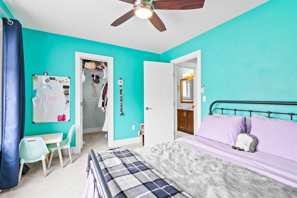 148 Baysprings Court Sw, Airdrie, AB - Indoor Photo Showing Bedroom