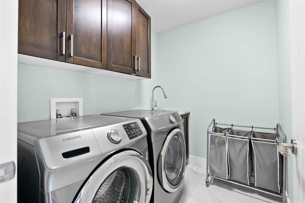 148 Baysprings Court Sw, Airdrie, AB - Indoor Photo Showing Laundry Room