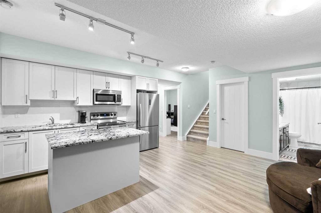 148 Baysprings Court Sw, Airdrie, AB - Indoor Photo Showing Kitchen With Upgraded Kitchen