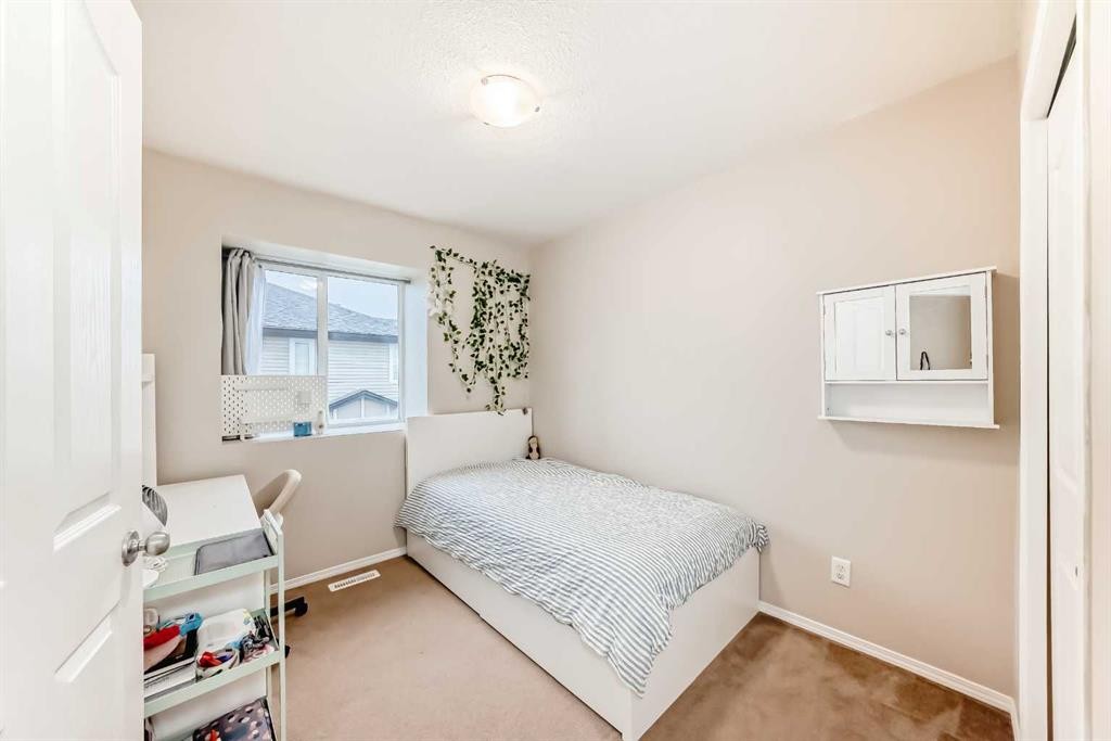 402-2066 Luxstone Boulevard Sw, Airdrie, AB - Indoor Photo Showing Bedroom