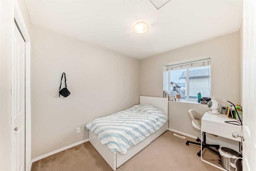 402-2066 Luxstone Boulevard Sw, Airdrie, AB - Indoor Photo Showing Bedroom