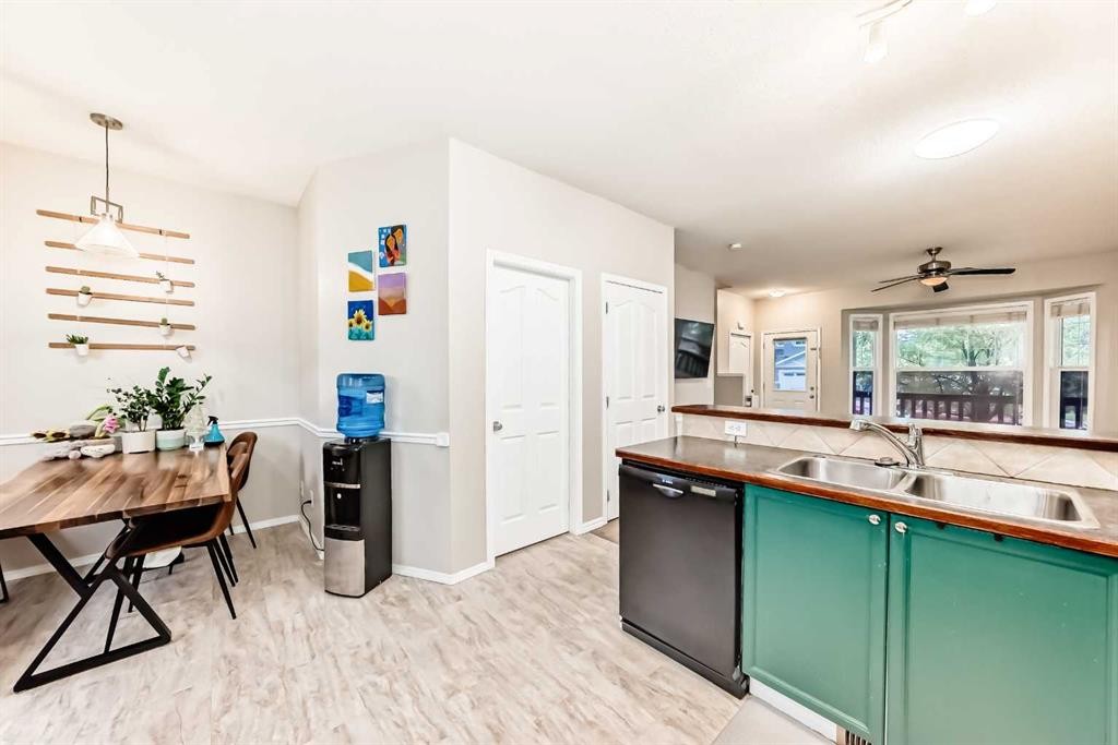 402-2066 Luxstone Boulevard Sw, Airdrie, AB - Indoor Photo Showing Kitchen With Double Sink