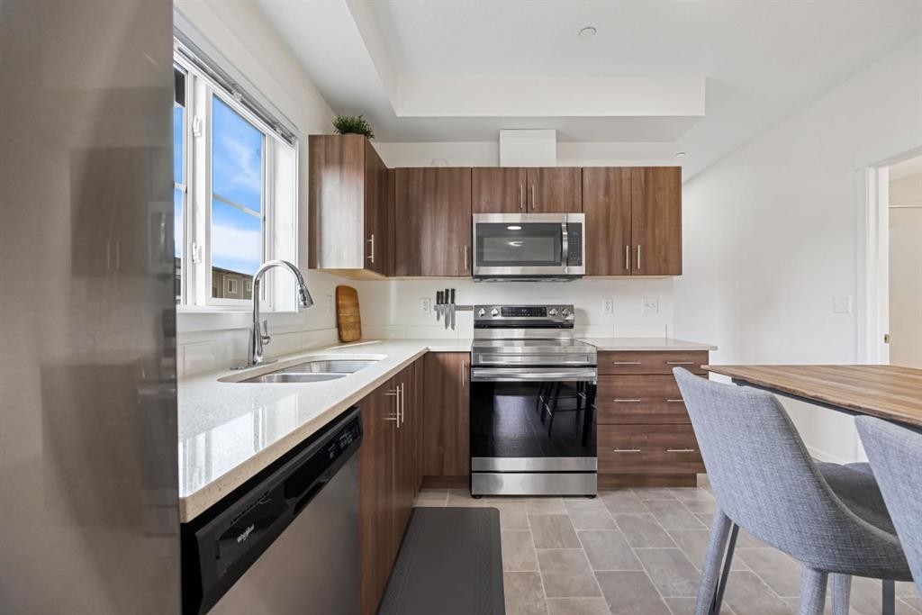 3308-215 Legacy Boulevard Se, Calgary, AB - Indoor Photo Showing Kitchen With Double Sink