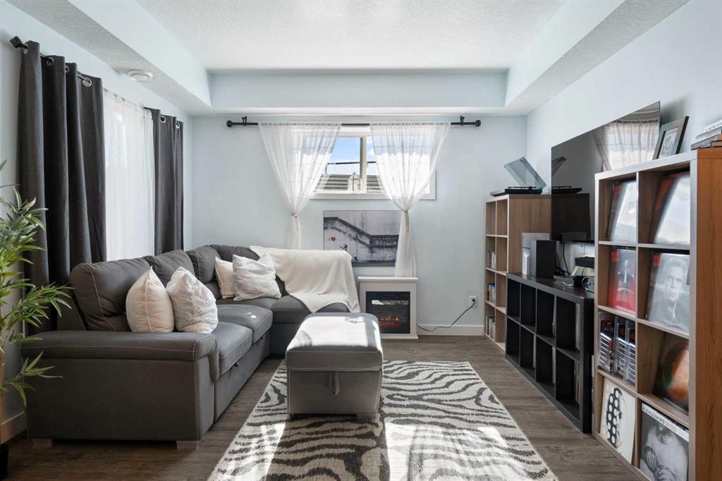 1104-2461 Baysprings Link Sw, Airdrie, AB - Indoor Photo Showing Living Room