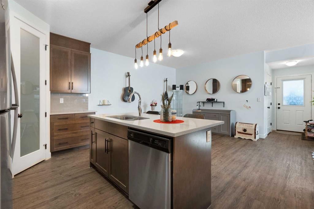 1104-2461 Baysprings Link Sw, Airdrie, AB - Indoor Photo Showing Kitchen With Double Sink