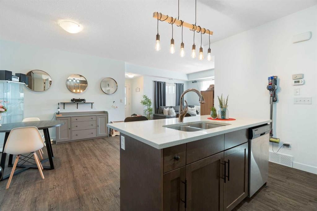 1104-2461 Baysprings Link Sw, Airdrie, AB - Indoor Photo Showing Kitchen With Double Sink