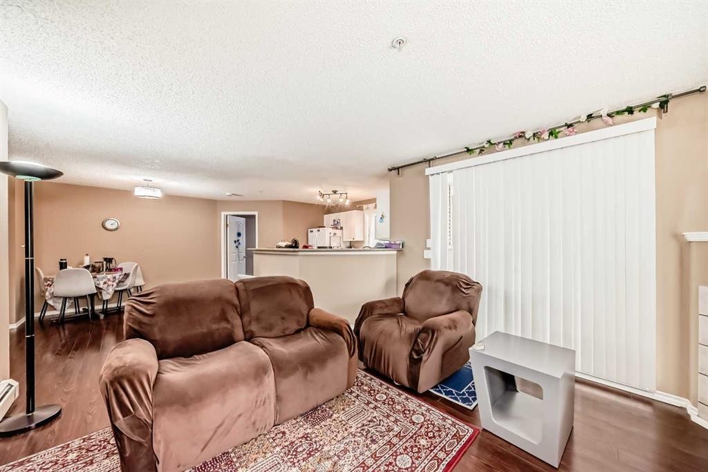 119-6000 Somervale Court Sw, Calgary, AB - Indoor Photo Showing Living Room