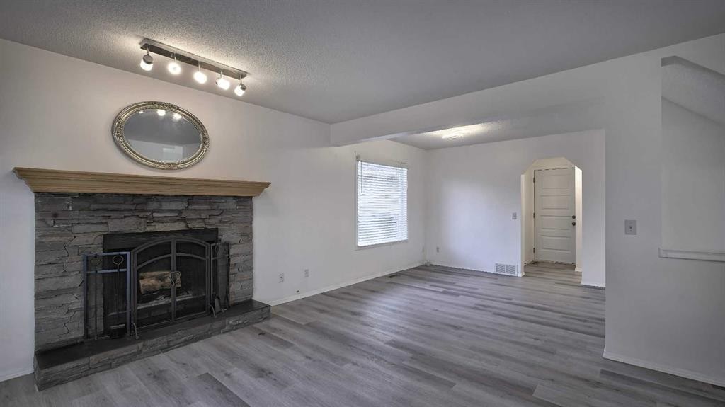 160 Riverstone Crescent Se, Calgary, AB - Indoor Photo Showing Living Room With Fireplace