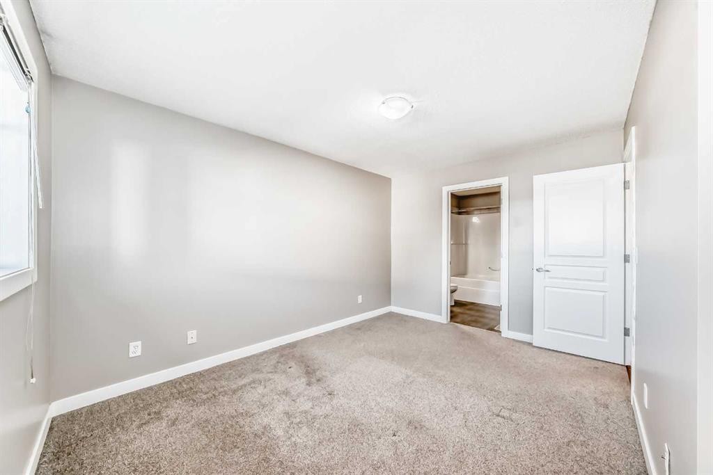 33 Cimarron Vista Gardens, Okotoks, AB - Indoor Photo Showing Other Room