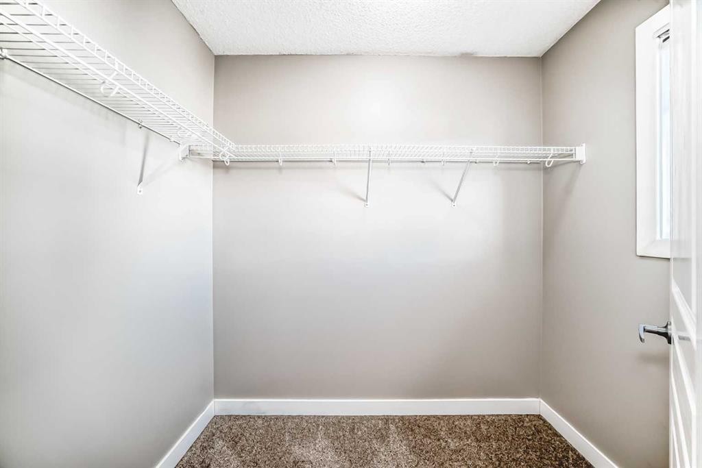 33 Cimarron Vista Gardens, Okotoks, AB - Indoor With Storage