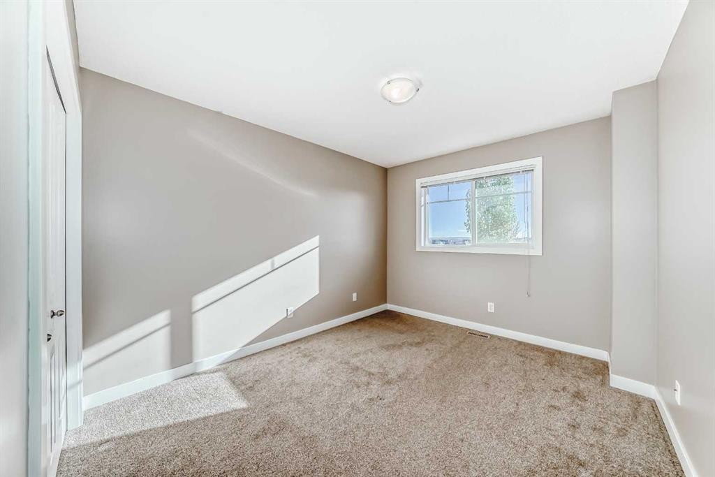 33 Cimarron Vista Gardens, Okotoks, AB - Indoor Photo Showing Other Room