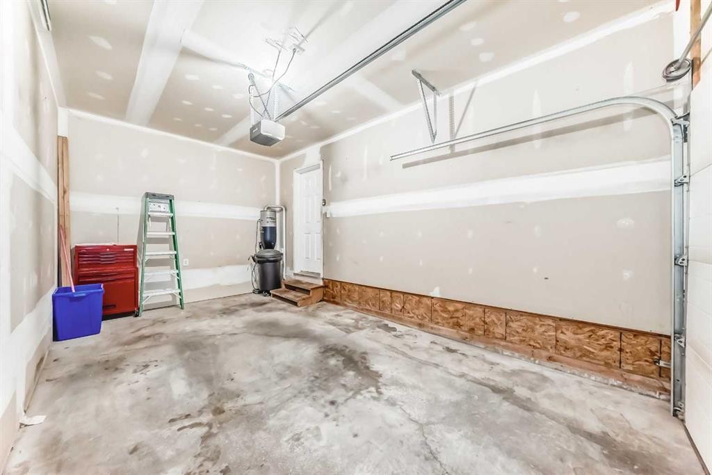 33 Cimarron Vista Gardens, Okotoks, AB - Indoor Photo Showing Garage