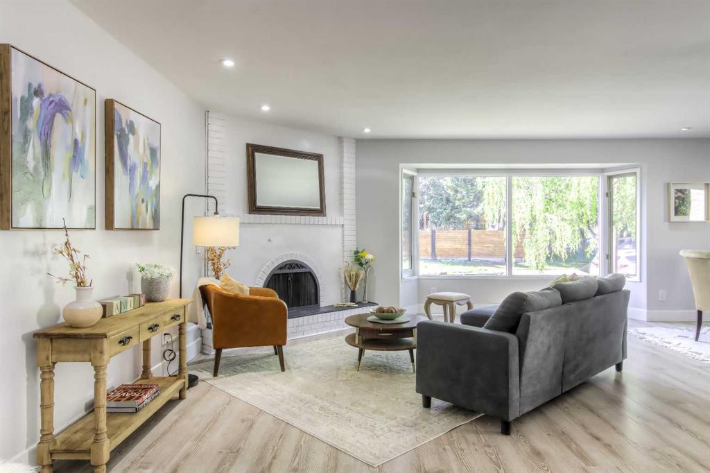 511 Cedarille Crescent Sw, Calgary, AB - Indoor Photo Showing Living Room With Fireplace