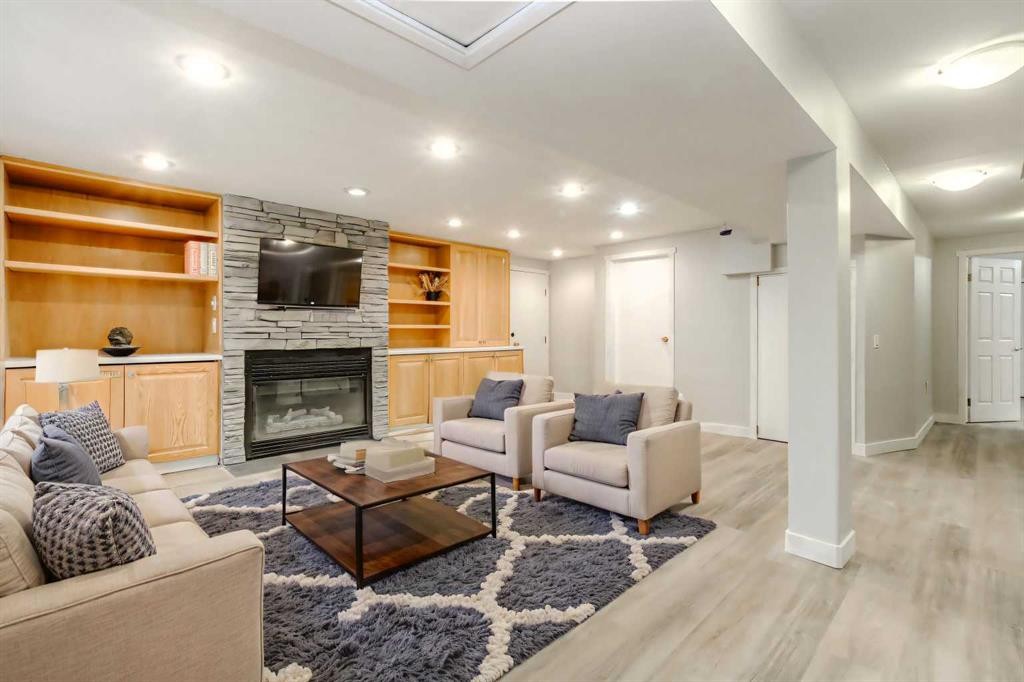 511 Cedarille Crescent Sw, Calgary, AB - Indoor Photo Showing Living Room With Fireplace